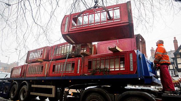A traditional red "K6" telephone box is removed from Warwick town centre. BT are removing a batch of underused phone boxes from around the country, under a scheme started in 2008. They are refurbished by kiosk and pay phone specialist X2 Connect and then sold off to the public. Prices start at £1,950. More info: Emma Tennant, BT, 0121 232 6683; Dan Thomas, BT, 0207 356 5369